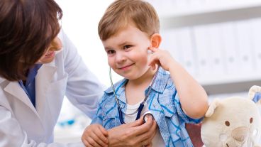 Doctor examining child